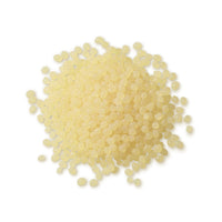 Pile of Pale Amber Biodegradable Hot Melt Pellets