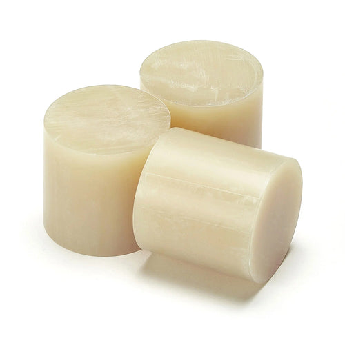 Three Casttec adhesive slugs