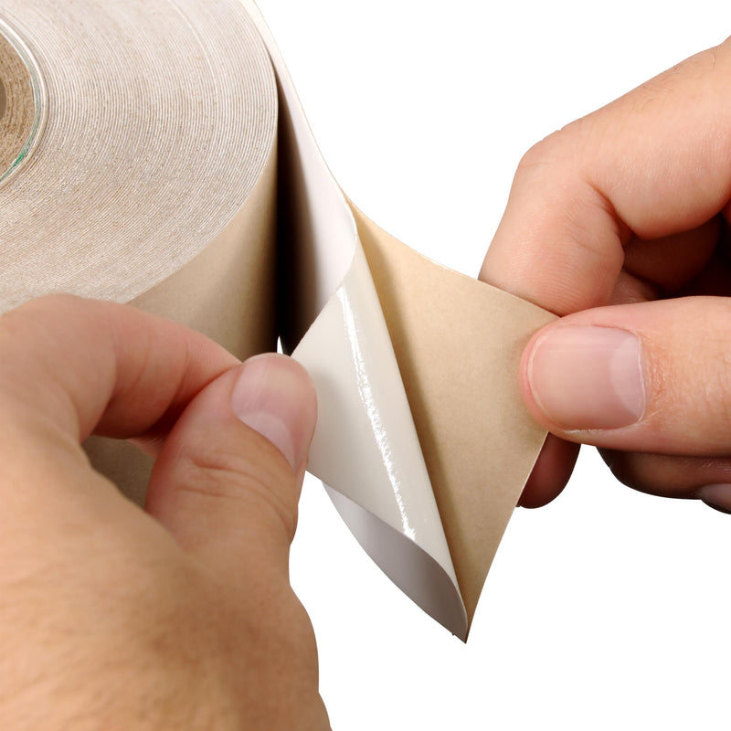 Hands applying 3M Industrial Sealing Tape IS1 and removing tan liner to expose adhesive