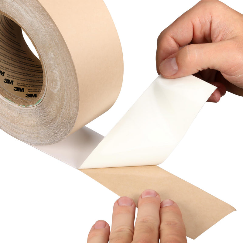 Close-up of 3M Industrial Sealing Tape IS1 backing being peeled to show adhesive layer