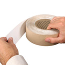 Person unrolling 3M Industrial Sealing Tape IS1 to apply waterproof seal on surface