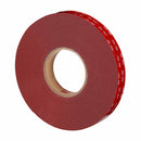 Angled side view of 3M VHB Max-060GF foam tape roll showing red liner.
