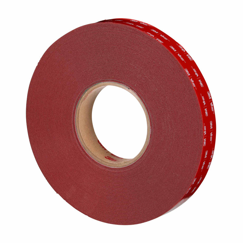 Angled side view of 3M VHB Max-060GF foam tape roll showing red liner.