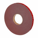 Angled side view of 3M VHB Max-110GF foam tape roll with red 3M liner intact.