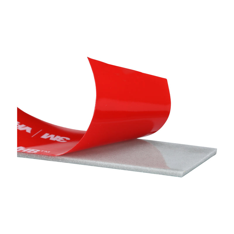 Close-up of 3M VHB Max-160GF double-sided acrylic foam tape showing liner being lifted.