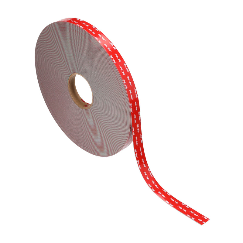 3M VHB Max-230GF foam tape roll with red liner raised at the edge, liner still covering adhesive.