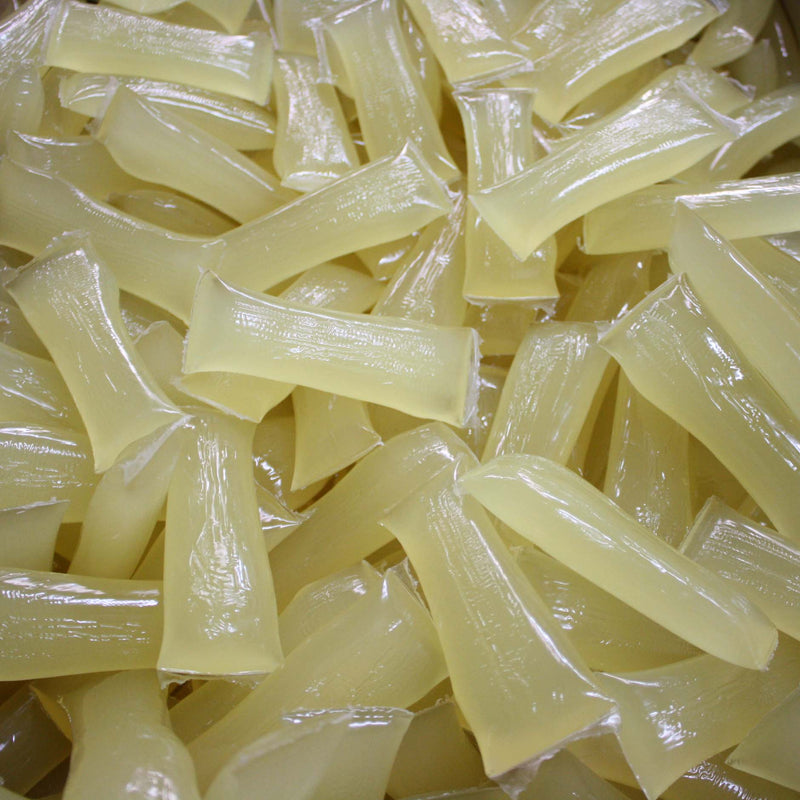 ASURE® CC1443 clear pressure sensitive hot melt adhesive pillows for side hinge bookbinding and coated paper applications