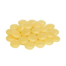 Light amber ASURE® PS6275 hot melt adhesive pastilles on a white background, flat round discs used for wrap-around labeling applications.