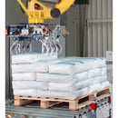 Automated palletizing line applying BREAKAWAY stabilization to poly bag packages.