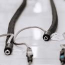 Close-up of Meler Arion Essential hot melt hose during testing with braided insulation and electrical connections