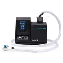 Meler Micron+ MOD hot melt system with automatic feeder and flexible suction hose for continuous adhesive supply.