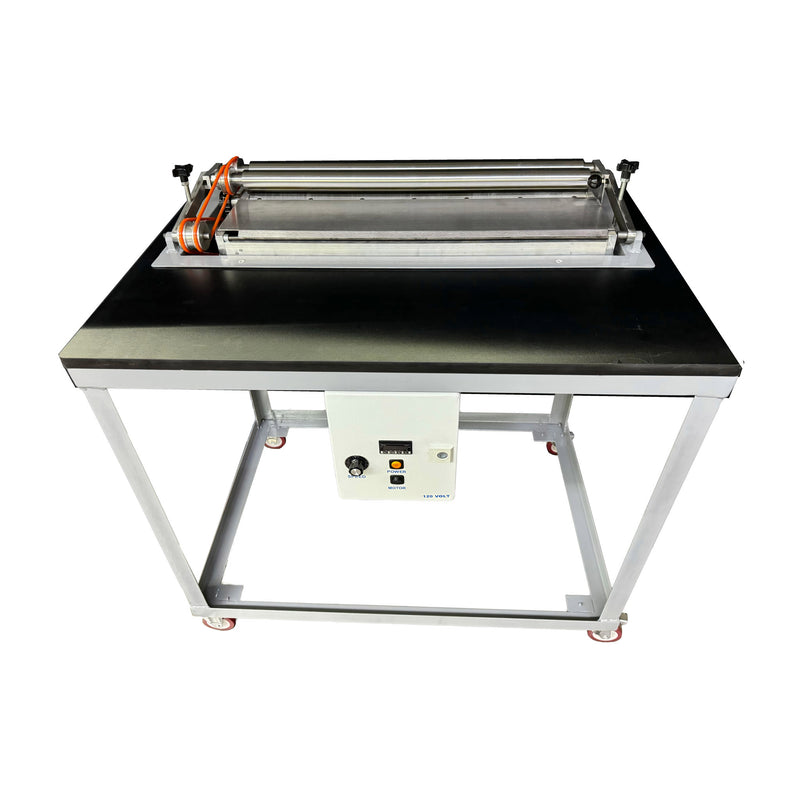 Top front view of hot melt roll coater mounted to table with wheels