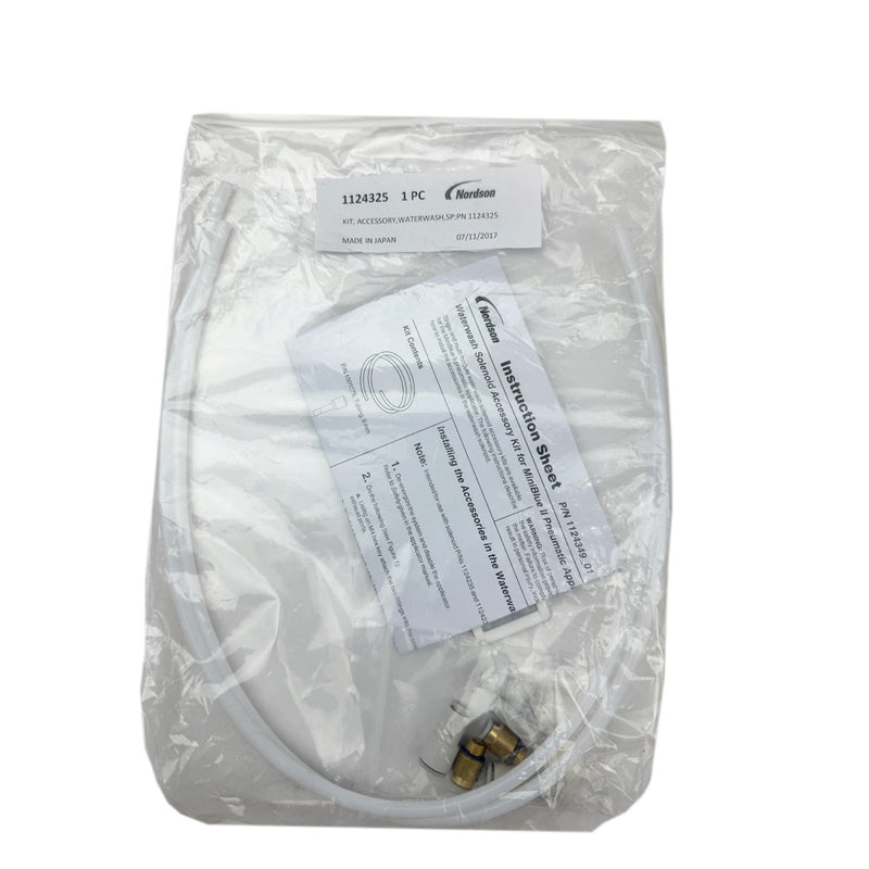 Nordson 1124325 WaterWash solenoid accessory kit with hoses, fittings, and an instruction sheet.