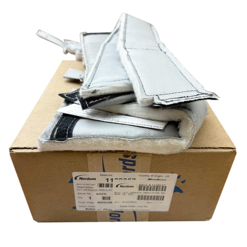 Nordson 1128257 insulation sleeve kit placed on top of its original labeled packaging, showing the insulated fabric material