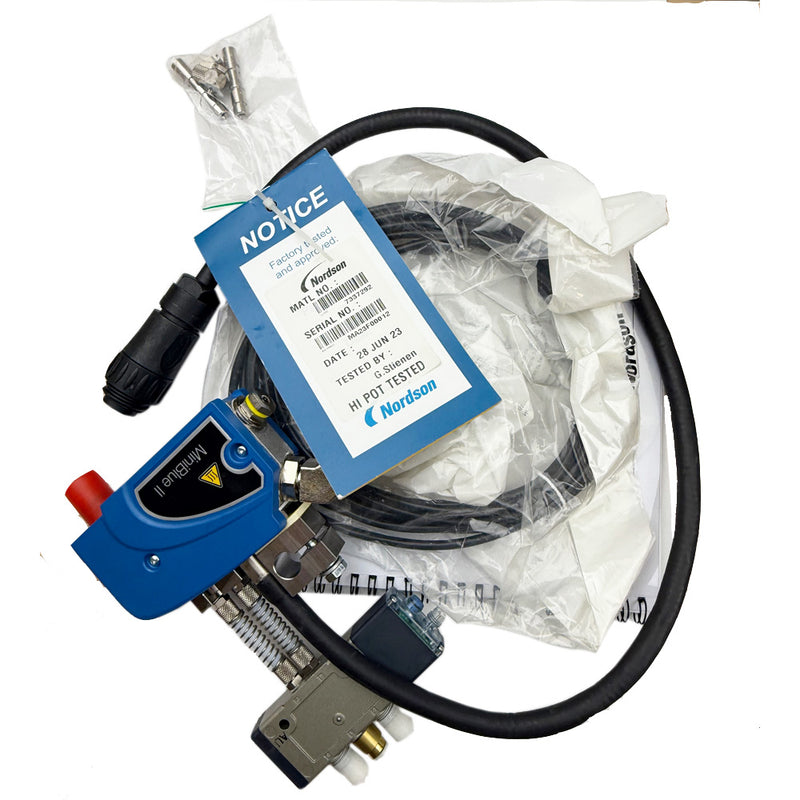 Nordson 7335152 hot melt applicator assembly with hoses, connectors, and part label.