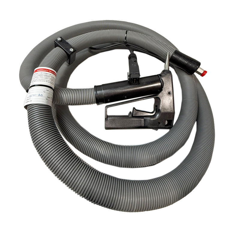 A gray, ribbed hot melt hose connected to a black industrial hot melt AX 360 applicator gun, designed for Nordson adhesive dispensing applications.