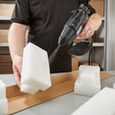 Power Adhesives hot melt spray gun coating foam inserts with adhesive for protective packaging applications.