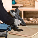 Tec 7300 spray glue gun applying hot melt adhesive to bond foam material directly to a wood panel.