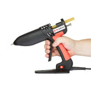 Power Adhesives Tec 806 glue gun held in hand, highlighting slim profile, trigger control, and jobsite usability