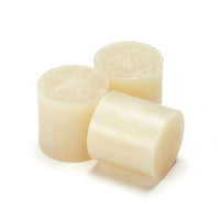 Foundrytec 601 hot melt glue slugs shown in pale amber, used for fast-setting sand core bonding in foundry applications.