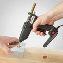 Applying hot melt adhesive into a wood joint using the Tec 305 glue gun from Power Adhesives during a controlled knot filling task