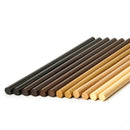 A selection of colored wood repair hot melt sticks shown together, illustrating the Knottec 7713 polyamide filler range from Power Adhesives.