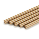 Grouped oak-tone hot melt repair sticks highlight the solid polyamide construction of Power Adhesives Knottec 7713 for wood restoration.