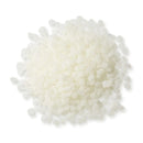 Close-up of Power Adhesives Tecbond 351B biodegradable hot melt adhesive pellets, off-white in color.
