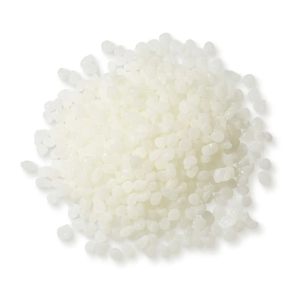 Close-up of Power Adhesives Tecbond 351B biodegradable hot melt adhesive pellets, off-white in color.